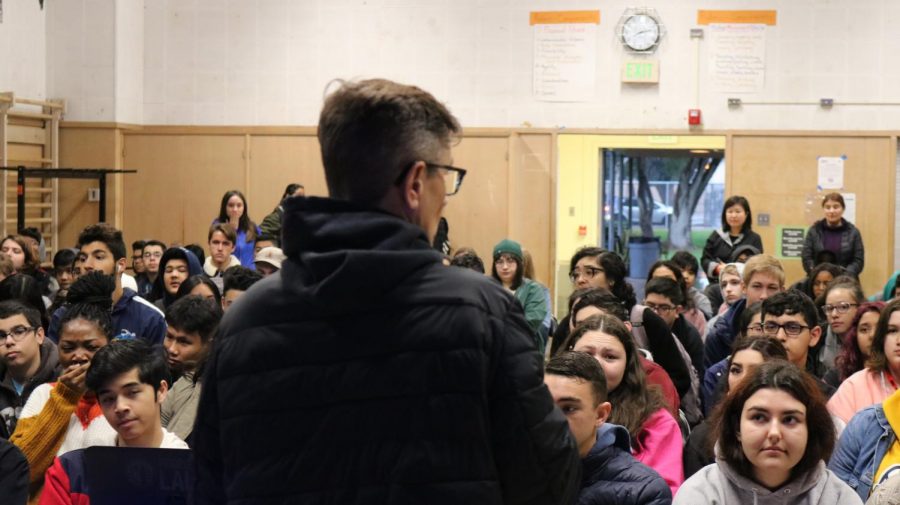 DPMHS principal, Deb Smith, speaks to students stuffed into the MPR due to lack of teachers.